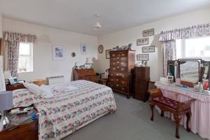 Bedroom One- click for photo gallery